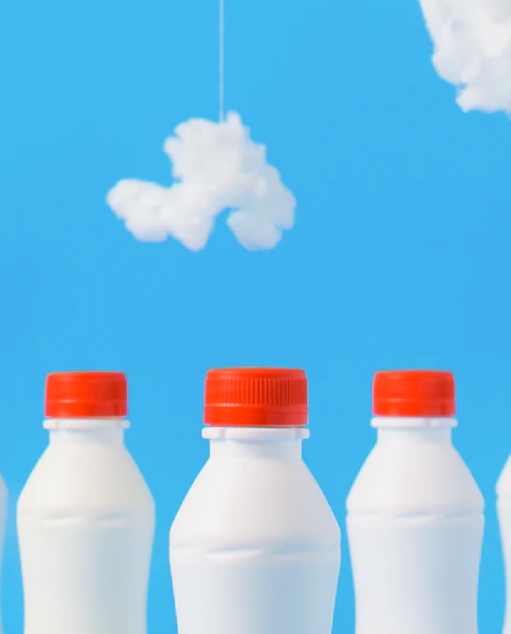 milk bottles on blue background