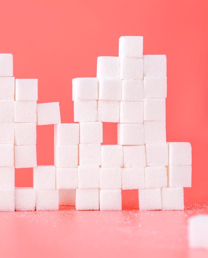 sugar cubes on red background
