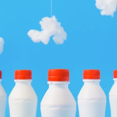 milk bottles on blue background